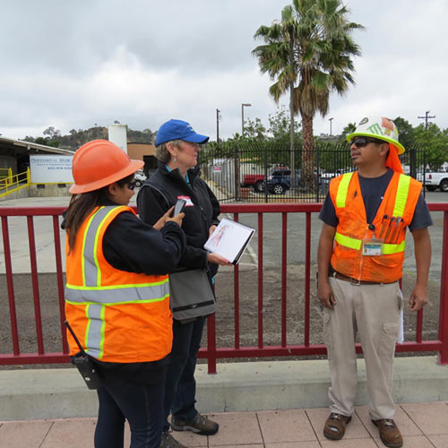 Dolores Baker sketched line workers then showed them her work.