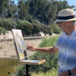 Richard McKinley squints as he makes final adjustments to Pacific Sentinels with a pastel pencil.