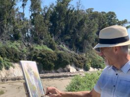 Richard McKinley squints as he makes final adjustments to Pacific Sentinels with a pastel pencil.