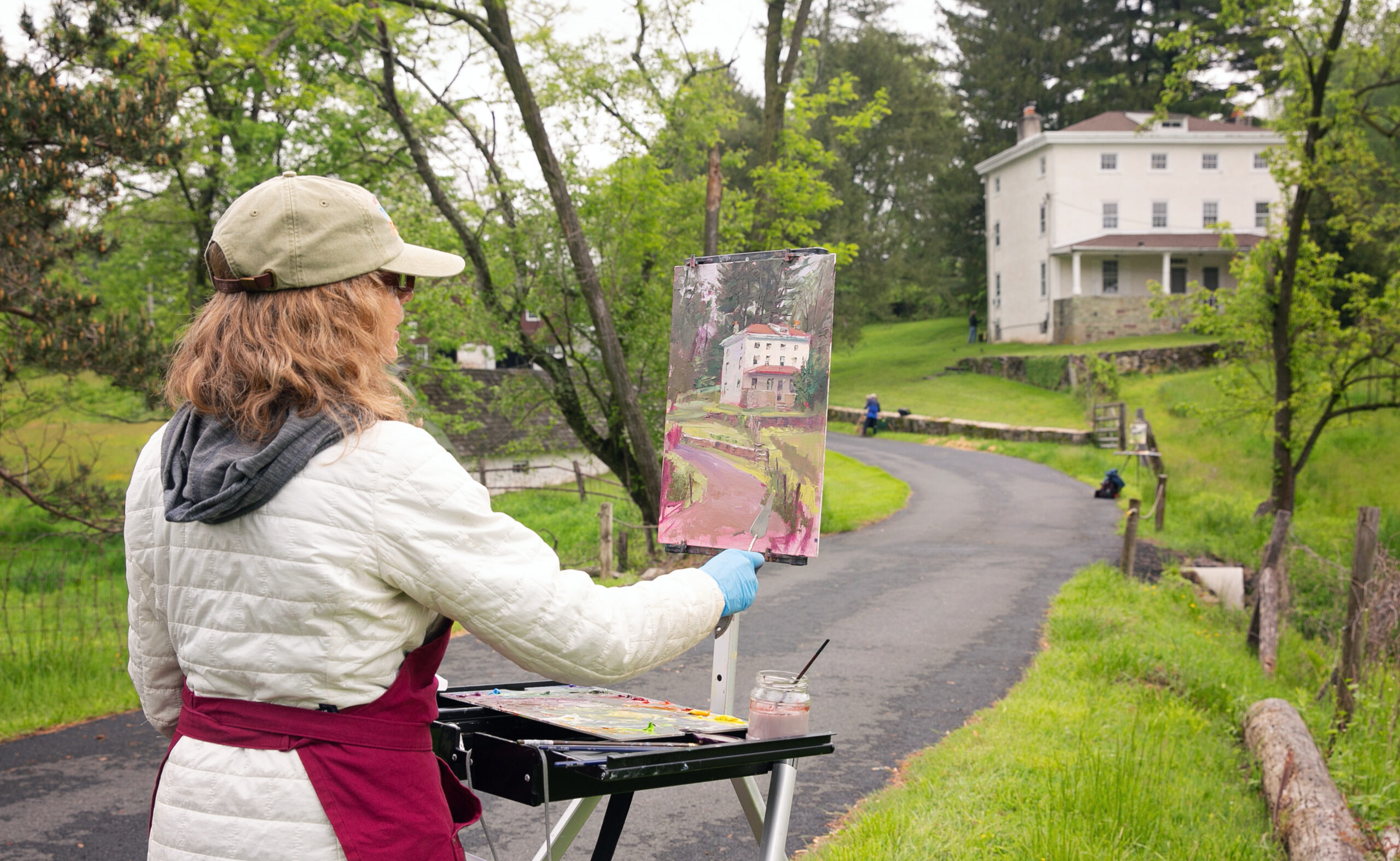 Michele Byrne painting on location at the Plein Air Festival