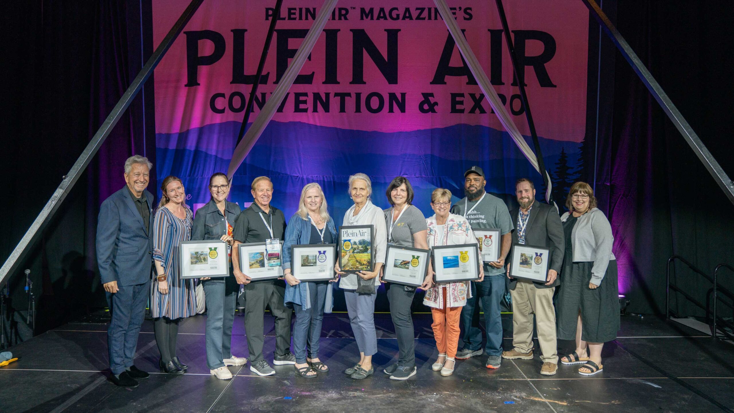 From the PleinAir Salon awards ceremony at the 11th Annual Plein Air Convention & Expo; Left to Right: Eric Rhoads, CherieDawn Haas, Suzie Baker, Rick J. Delanty, Deborah Chabrian, Camille Przewodek, Lisa Mozzini-McDill, Linda Delaney, Steven Walker, Charles Newman, Kelly Kane