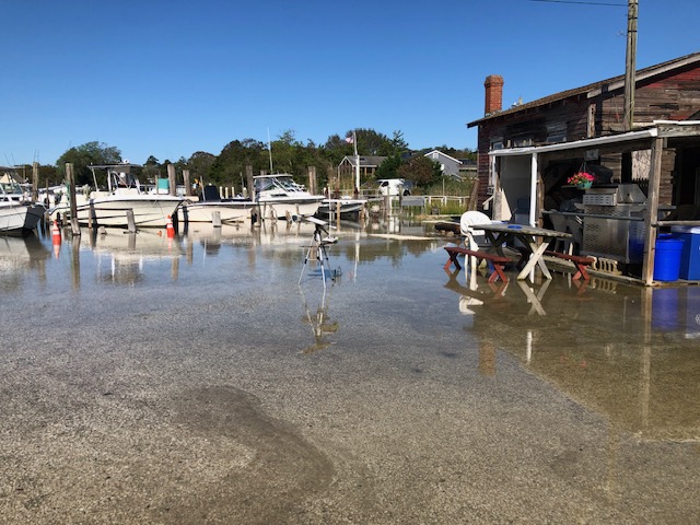 The water crept in, covering the parking lot.